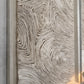 Textured wall panel with wavy pattern in neutral tones