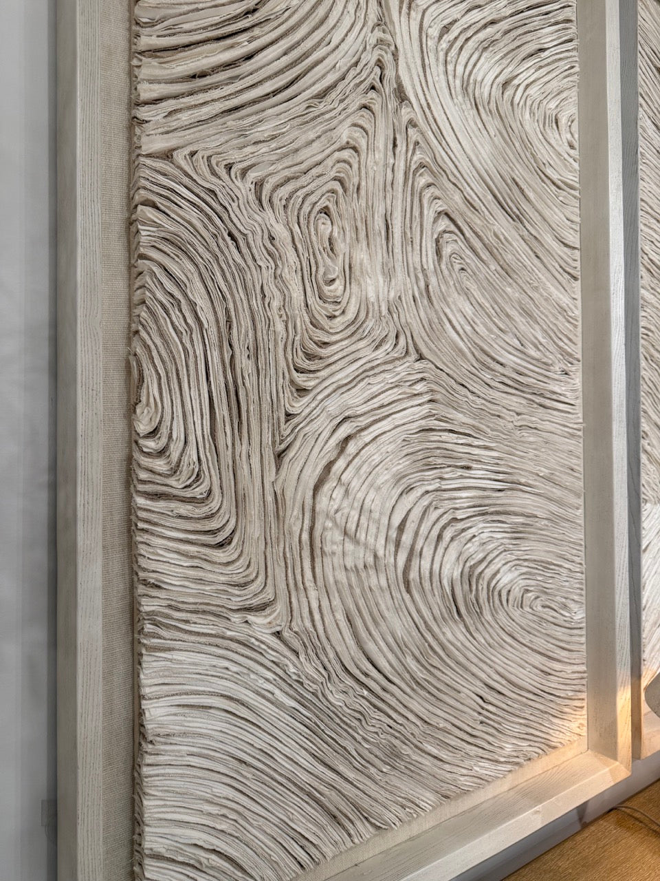 Textured wall panel with wavy pattern in neutral tones