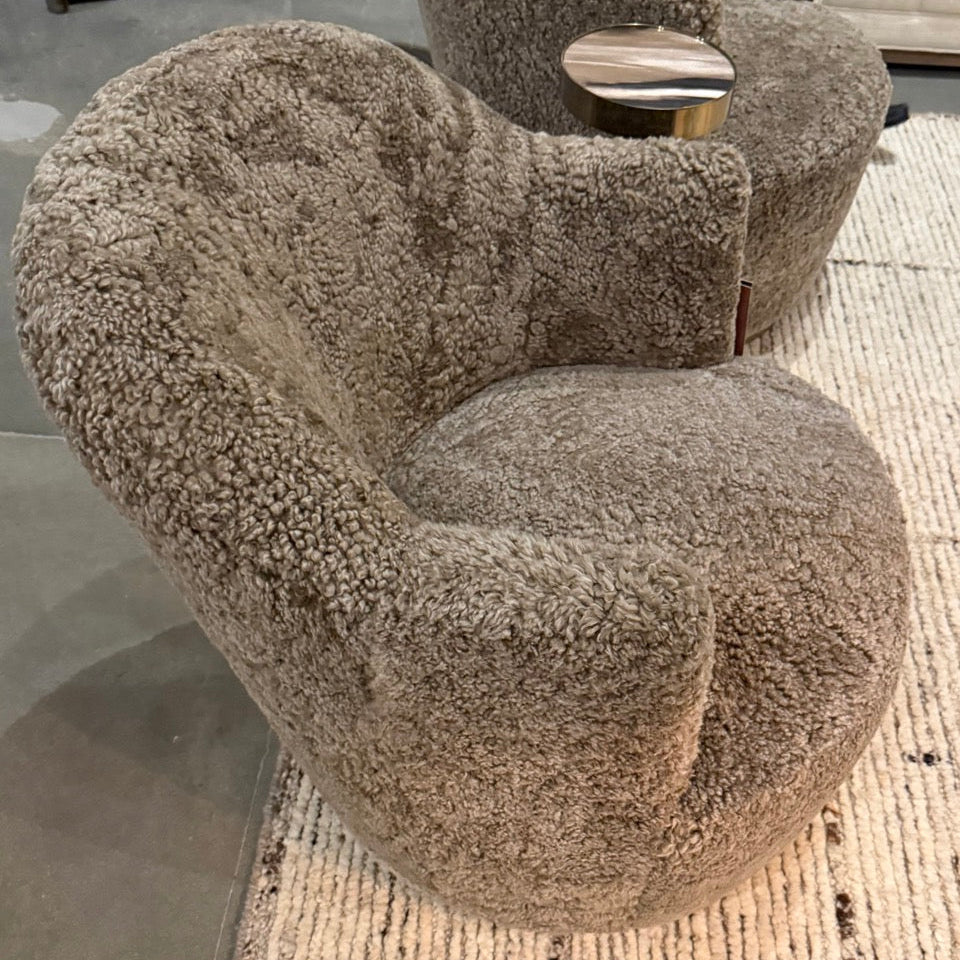 Textured armchair on a textured floor with a blurred background