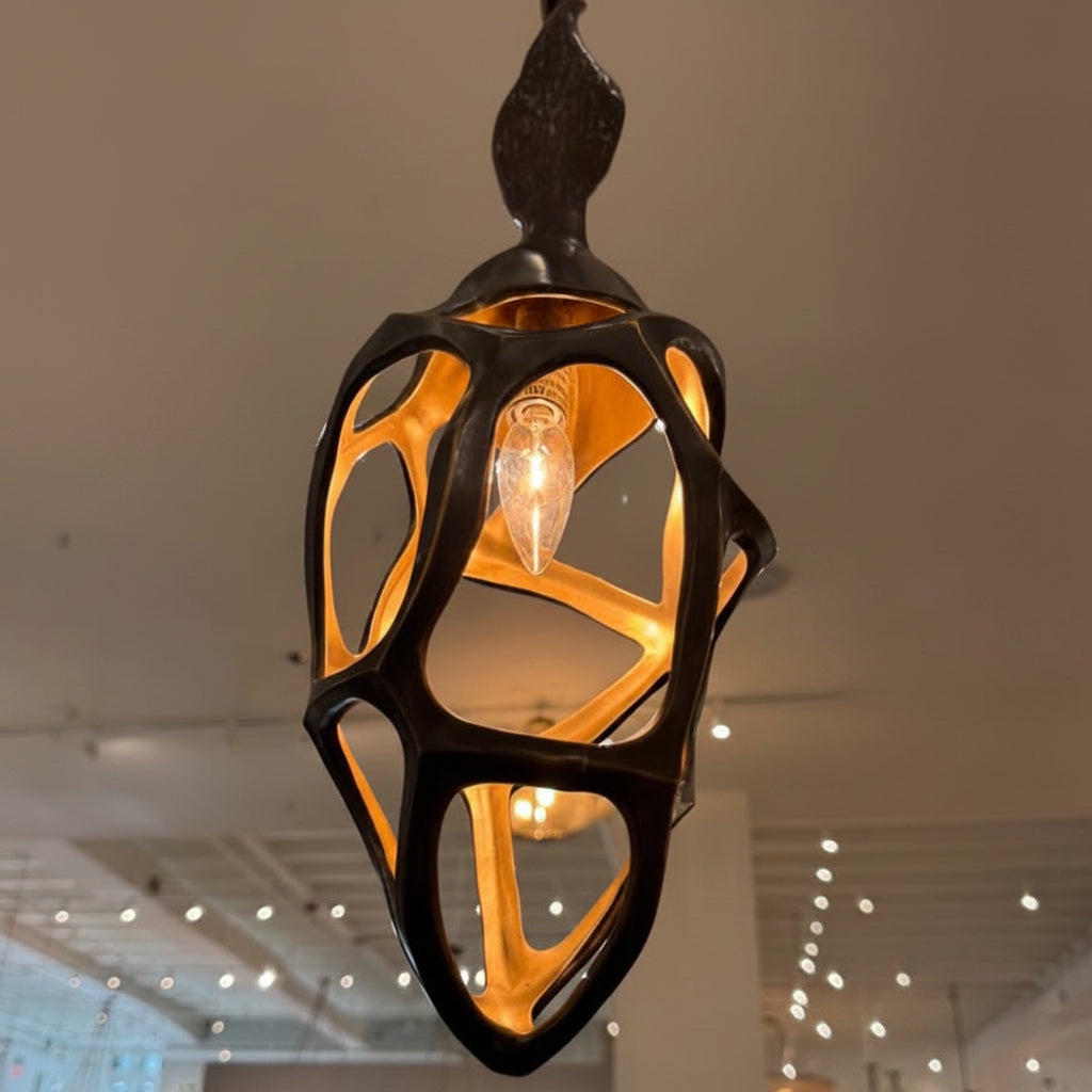 Decorative pendant light hanging in a store with other lighting fixtures.
