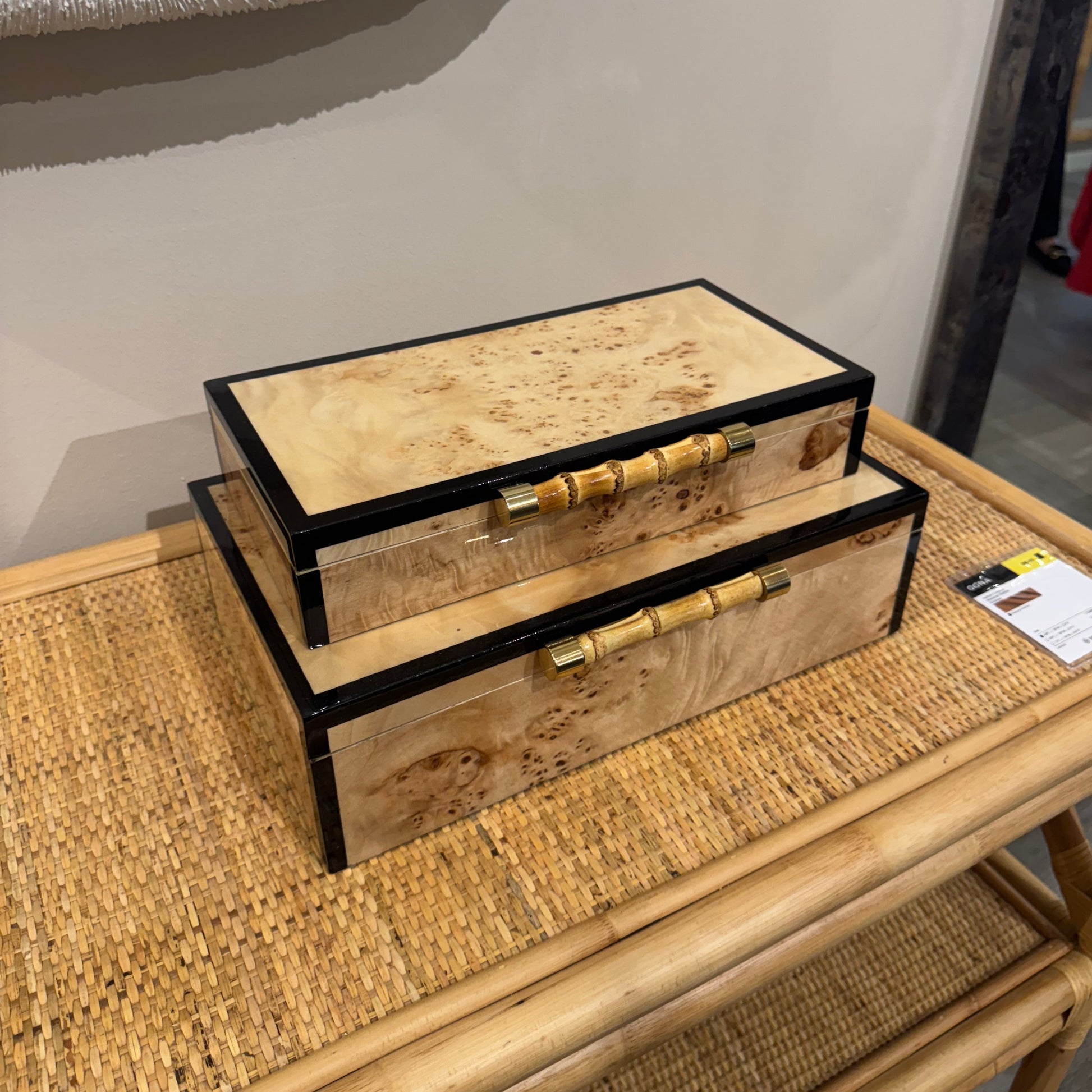 Wooden drawer with wicker frame on a light-colored surface