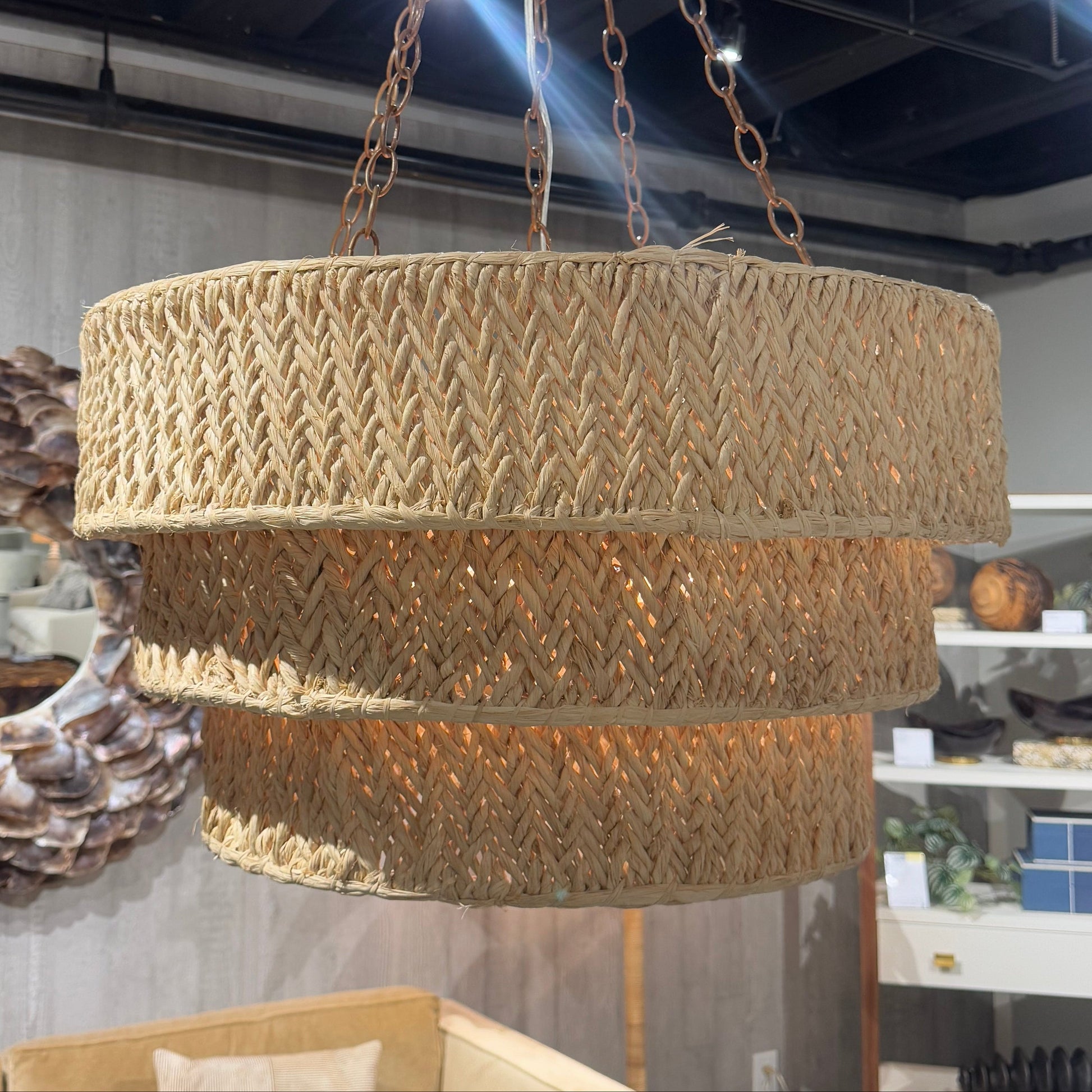 Gold textured round table with chains in a room setting