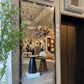 Framed mirror reflecting a room with decor elements