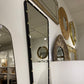 Decorative mirrors on a wall in a store setting
