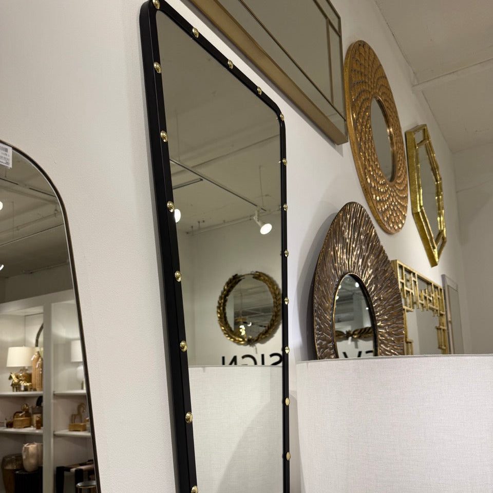 Decorative mirrors on a wall in a store setting