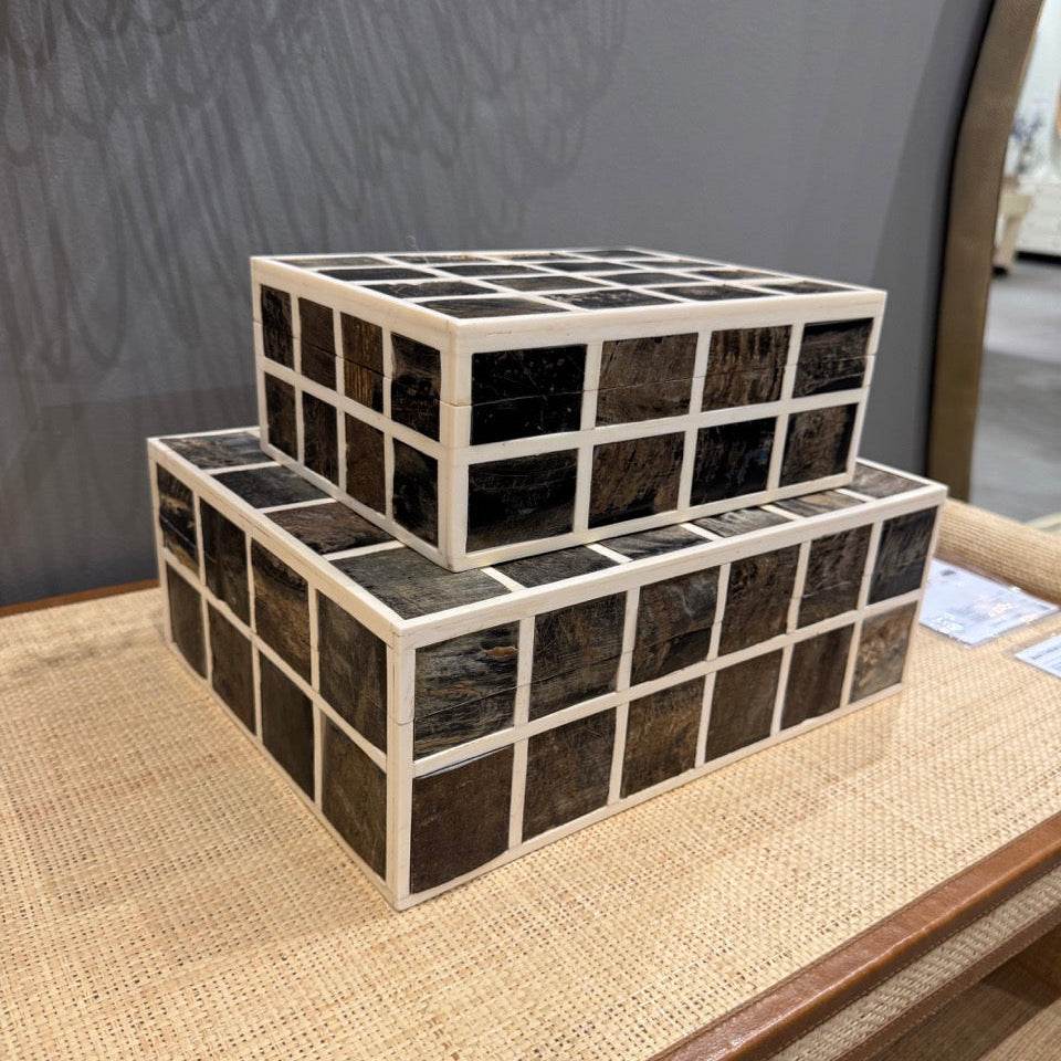 Decorative box with grid pattern on a surface