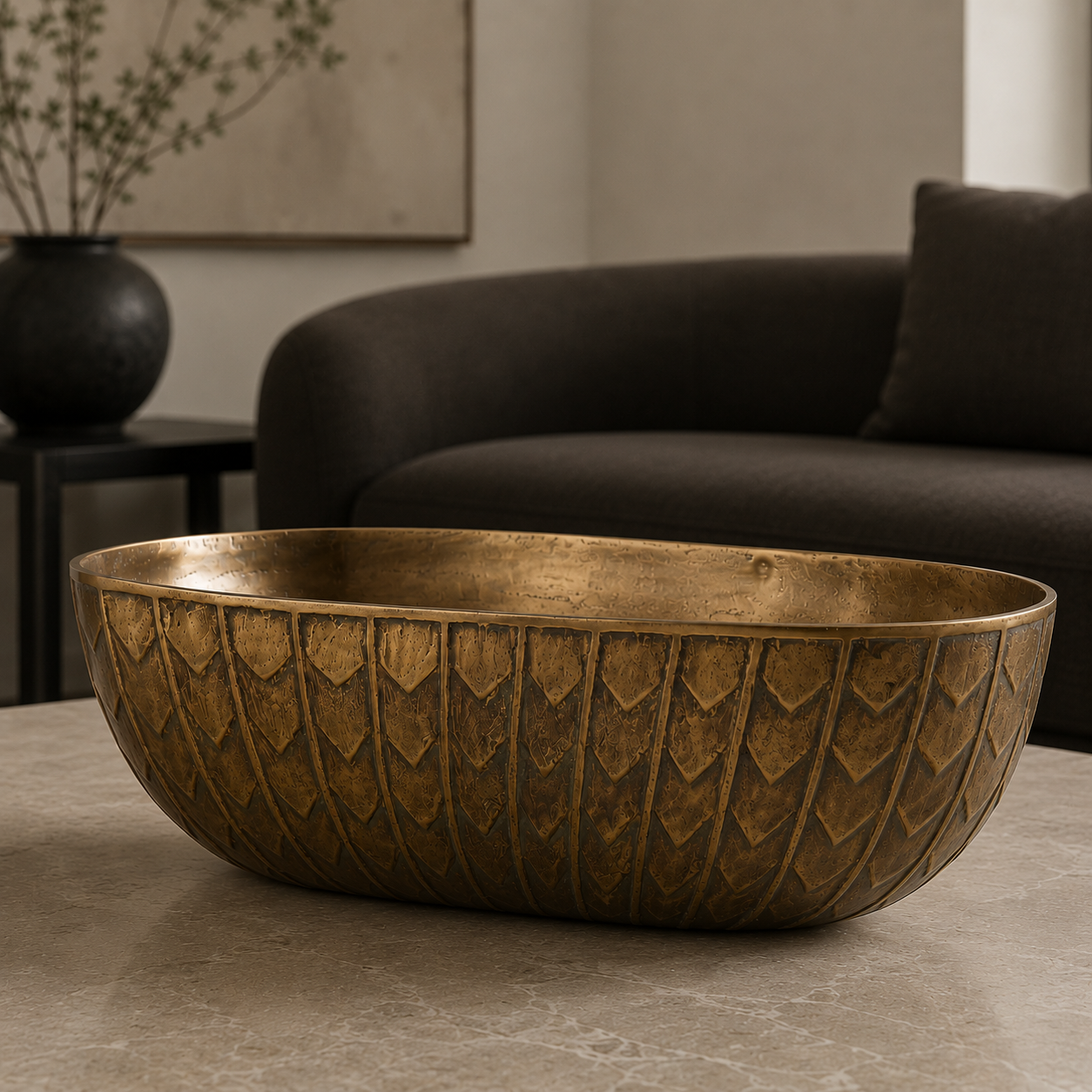 Bronze bowl with intricate leaf pattern in a neutral space