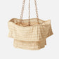 Beige woven hanging basket with chain on a light gray background
