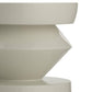 Close-up of a geometrically shaped white ceramic vase on a white background