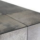 Close-up of a stone countertop with a gray and brown color pattern.