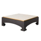 Square coffee table with black base and beige top on a white background
