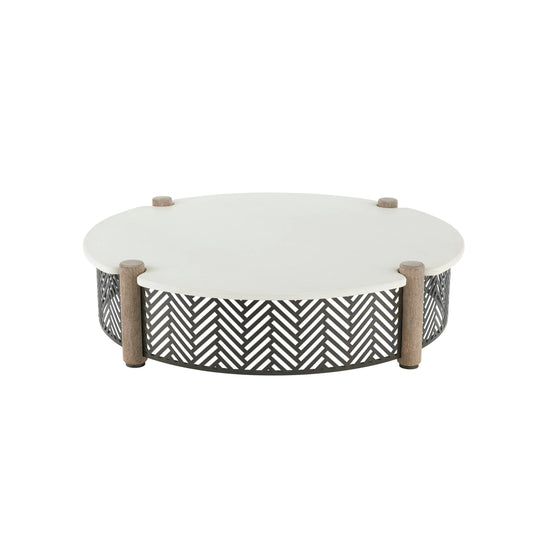 Round outdoor coffee table with a white top, weathered wood posts, and a black geometric chevron lattice base.