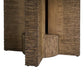Round outdoor dining table with a white stone top and sculptural textured brown pedestal base.