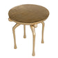 Round table with gold legs and wooden top on a white background