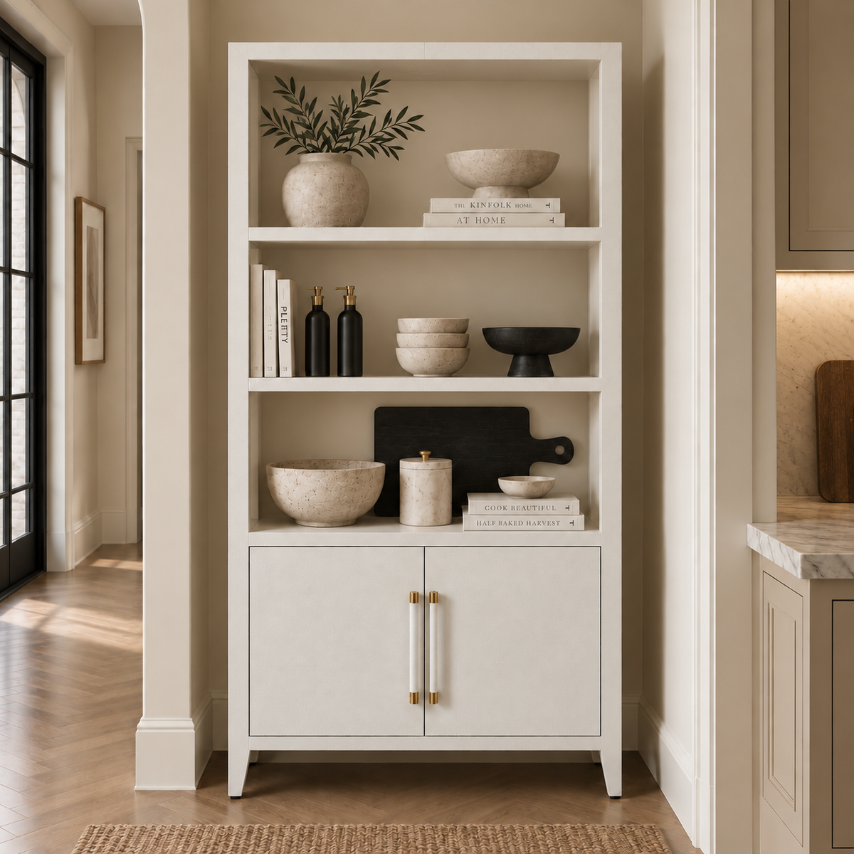 tall white bookshelf styled in a kitchen nook