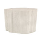 Round textured side table on a white background