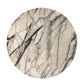 Round marble coaster with beige and black marbled pattern on a white background