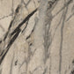 Close-up of a marble-like stone surface with gray and beige tones.