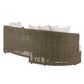 Woven outdoor sofa with white cushions on a white background