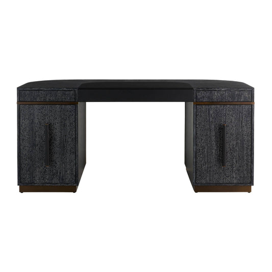 A modern writing desk with a black upholstered top, textured dark gray side panels, and bronze metal legs, shown against a plain white background.