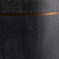 Close-up of a dark charcoal textured surface with fine vertical striations and a horizontal metallic bronze band across the middle.