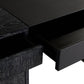 Close-up of a black wooden desk with a drawer open on a white background