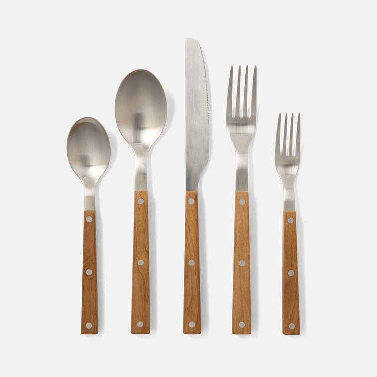 Five-piece flatware set with polished silver metal heads and warm brown wooden handles