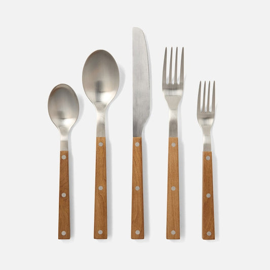 Five-piece flatware set with polished silver metal heads and warm brown wooden handles