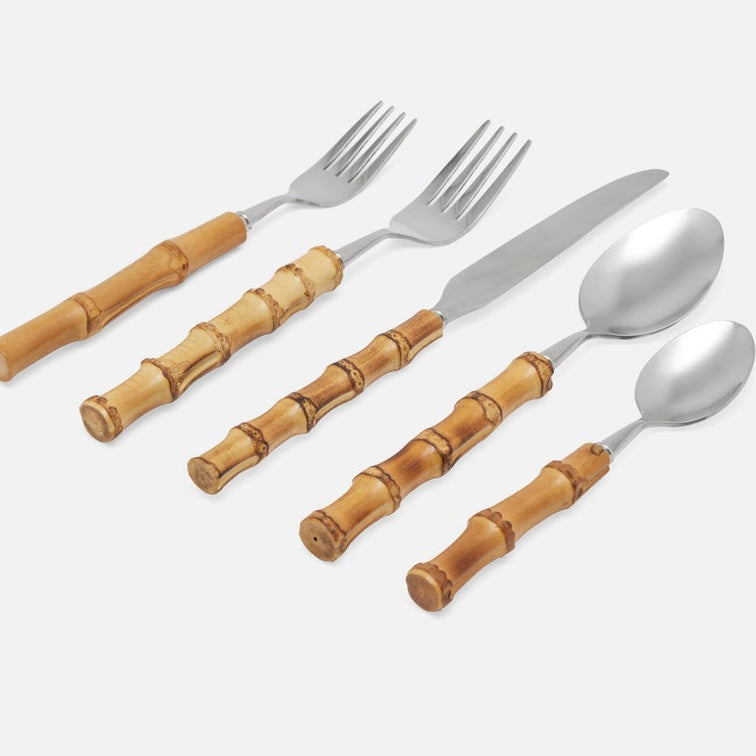 Five-piece flatware set with polished silver metal heads and warm brown wooden bamboo handles