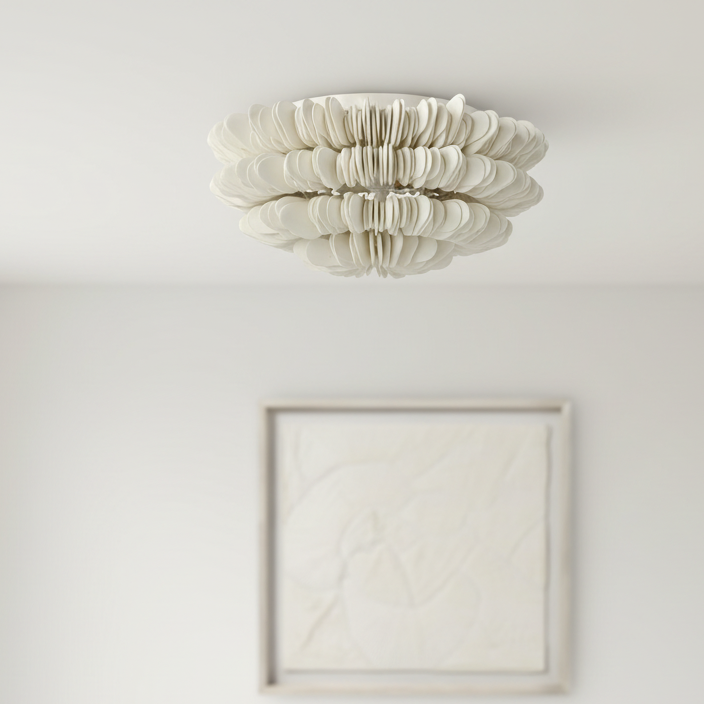 Ceiling light fixture in a minimalistic room with a framed picture on the wall.