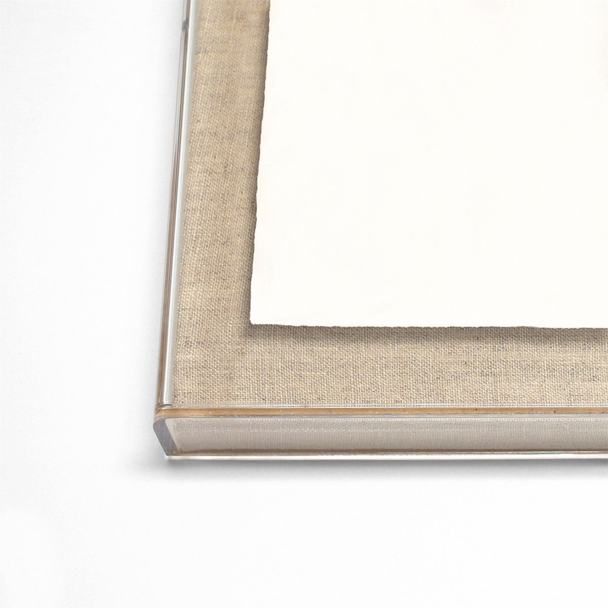 Close-up of a beige picture frame corner on a white background