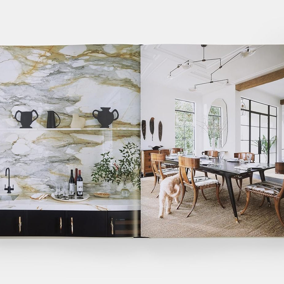 Open book showing interior design images of a kitchen and dining area.