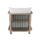 A modern outdoor accent chair featuring a light natural wood frame, a white cushion, and a dark brown and white herringbone patterned backrest.