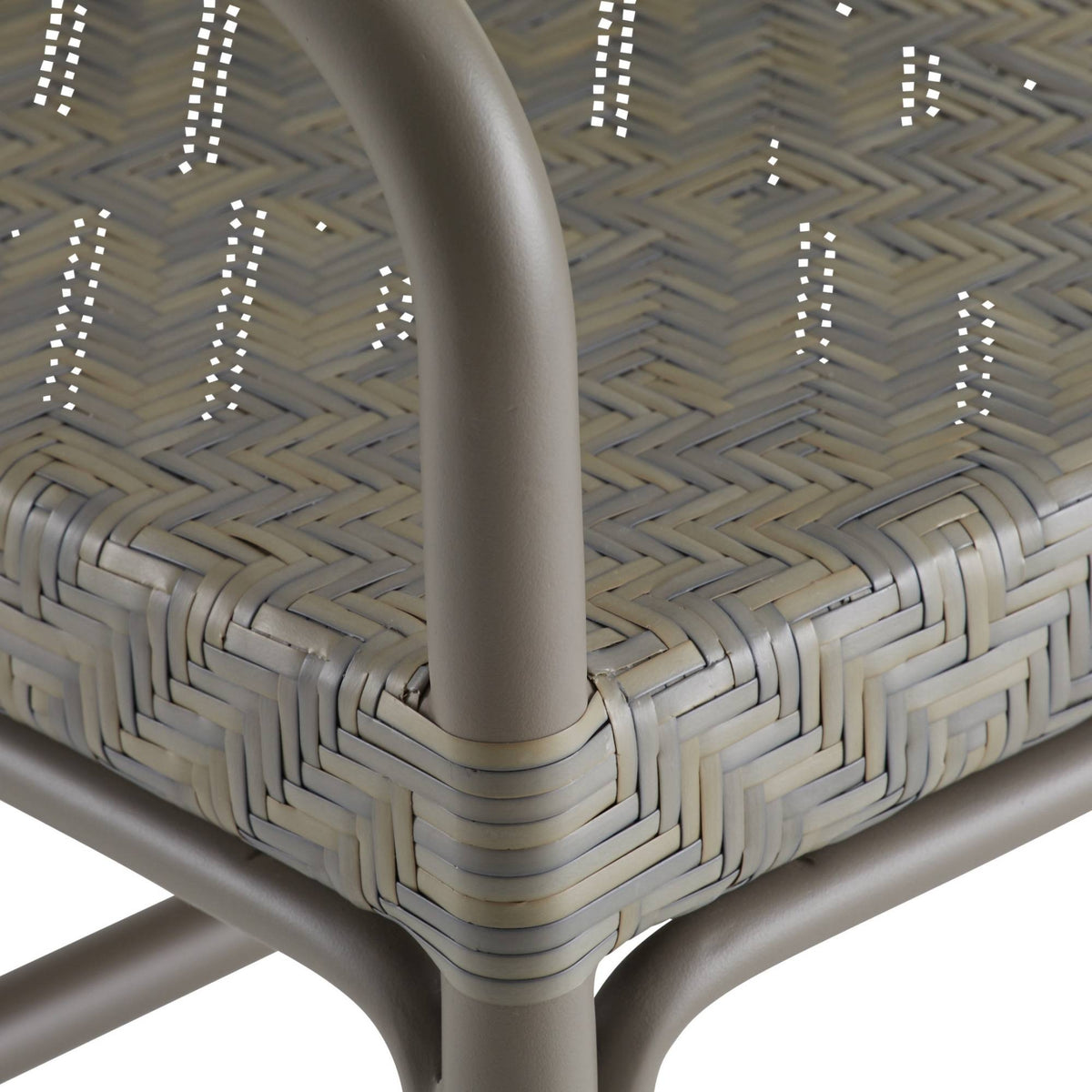 Close-up of a woven chair seat with a geometric pattern on a white background
