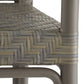 Close-up of a woven chair seat with a herringbone pattern on a white background