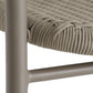 Close-up of a chair with woven seat and metal frame on a white background