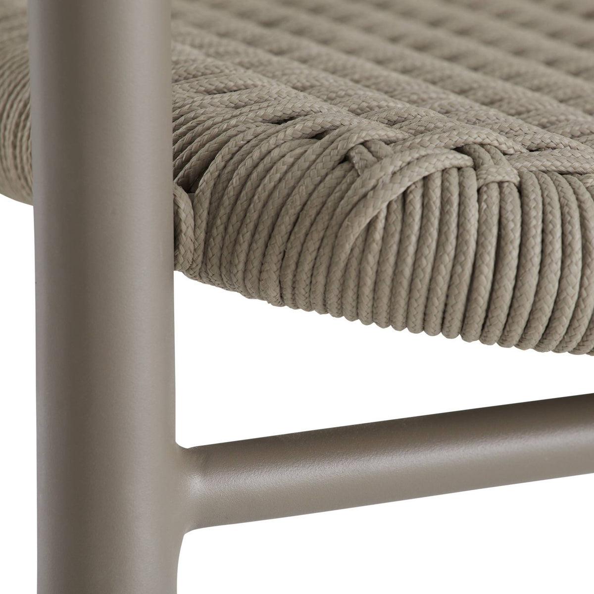 Close-up of a chair with woven seat and metal frame on a white background