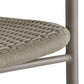 Close-up of a chair with woven seat and metal frame on a white background