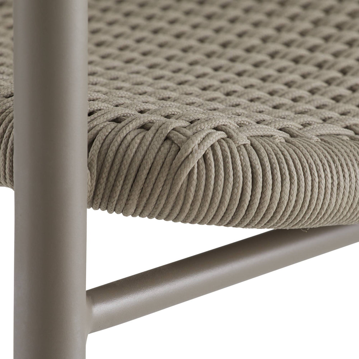 Close-up of a chair with woven seat and metal frame on a white background