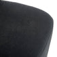 Close-up of a dark gray cushion on a chair with a white background