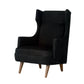 Black wingback chair with wooden legs on a white background