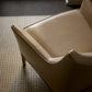 Beige armchair on a textured carpet