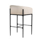 Bar stool with beige cushioned seat and black metal frame on a white background