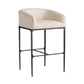 A modern barstool with a curved, upholstered cream seat and backrest, supported by a textured black metal frame with a footrest.