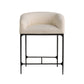 Beige cushioned chair with black metal frame on a white background