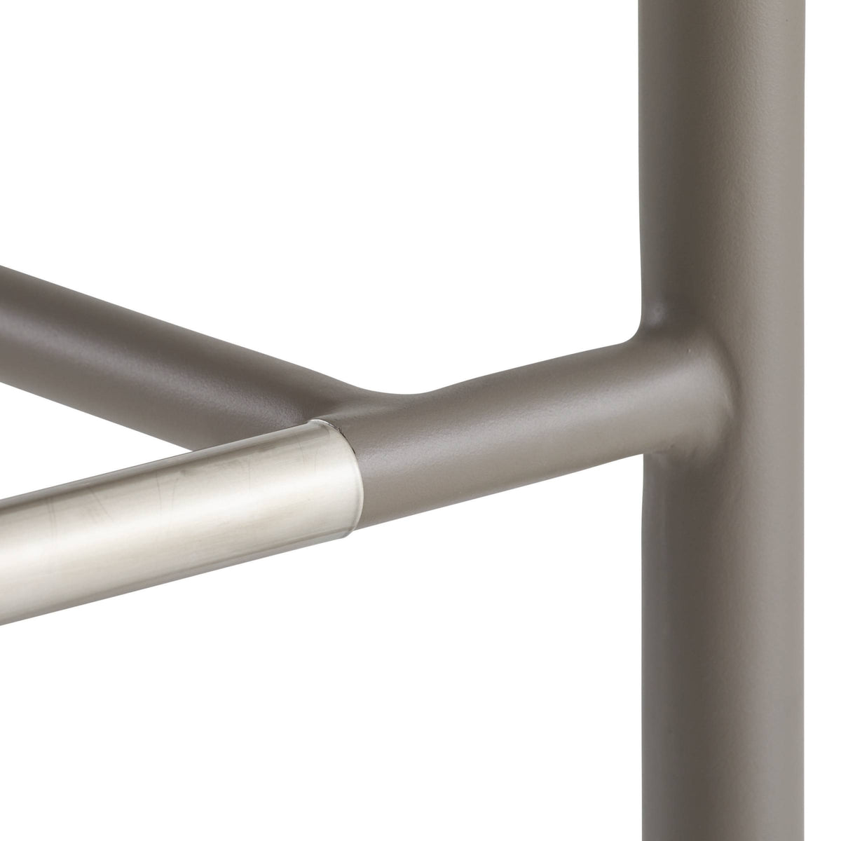 Close-up of a metal chair frame with a white background