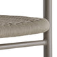 Close-up of a chair with woven seat and metal frame on a white background