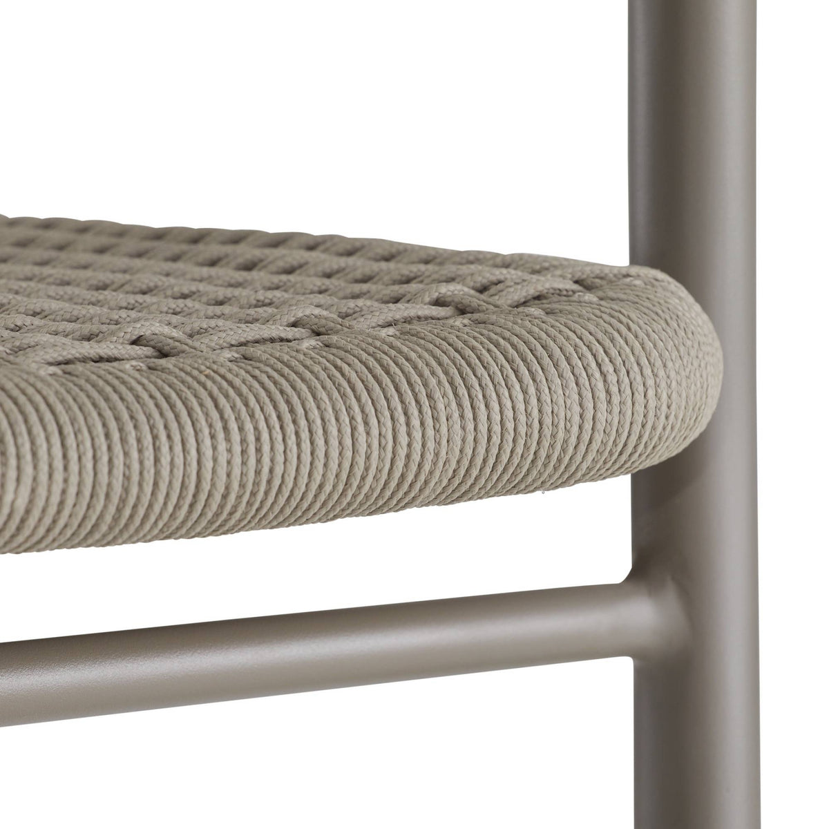 Close-up of a chair with woven seat and metal frame on a white background