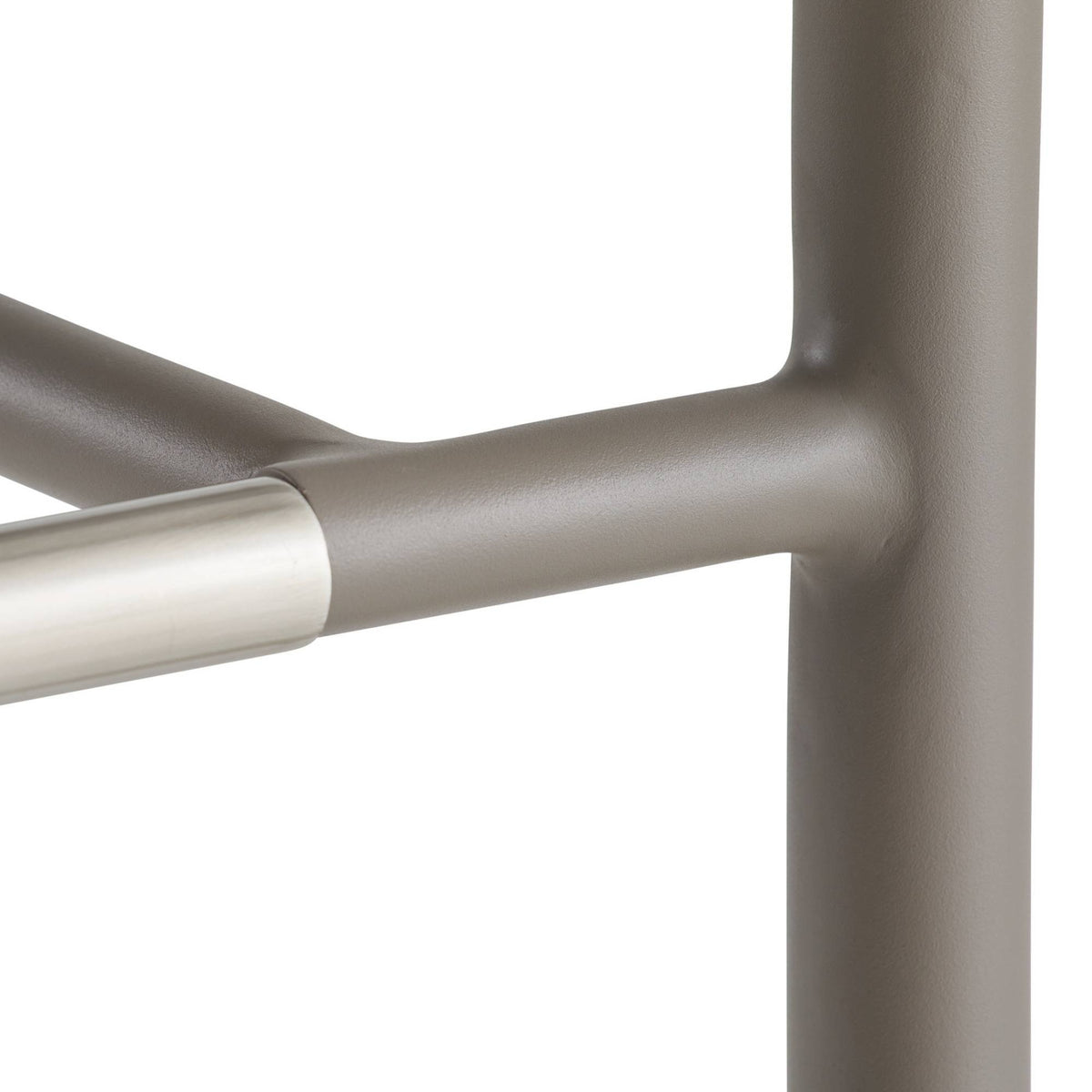 Close-up of a metallic chair frame on a white background
