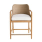 A modern bar stool featuring a light natural wood frame, a woven wicker backrest, and a thick white seat cushion, shown against a plain white background.